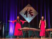 Felida: Yi Shen, center, was the guest of honor at the Vancouver Chinese Association’s new year celebration, and she performed with Jade Young, left, of Grass Valley Elementary School and Joy Young, right, of Skyridge Middle School.