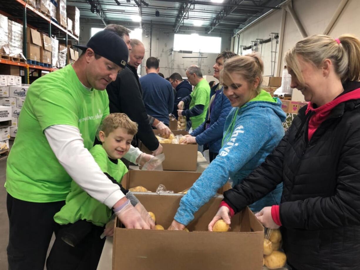 Walnut Grove: Kaiser Permanente employee volunteers and their families and friends volunteered to sort potatoes at the Clark County Food Bank in honor of Martin Luther King Jr. Day.