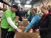 Walnut Grove: Kaiser Permanente employee volunteers and their families and friends volunteered to sort potatoes at the Clark County Food Bank in honor of Martin Luther King Jr. Day.