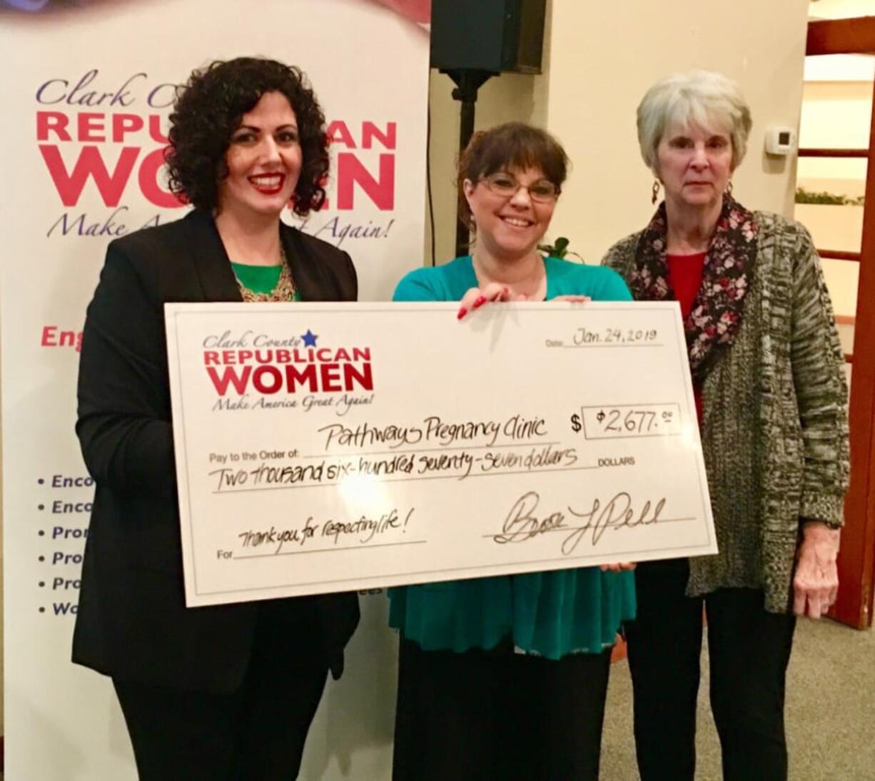 Washougal: Clark County Republican Women President Brook Pell, left, presents a check to Kimberli Swenson, executive director of Pathways Pregnancy Clinic, center.