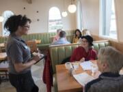 Dea Taylor, from left, takes a lunch order from Carolyn Walz and Anne Garlinghouse during the lunch rush Tuesday at The Diner Vancouver, a new restaurant owned by Meals on Wheels People that had a soft opening Feb. 11. “We have so many repeat customers already,” Taylor said.