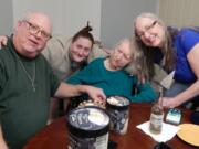 Mike Willsey of Lake Ann, Mich., poses for a first family photo with sister Katherine Seymour of Seaside, Ore., birth mother Mary Elizabeth Baker of Vancouver and sister Karen Pederson, also of Vancouver.