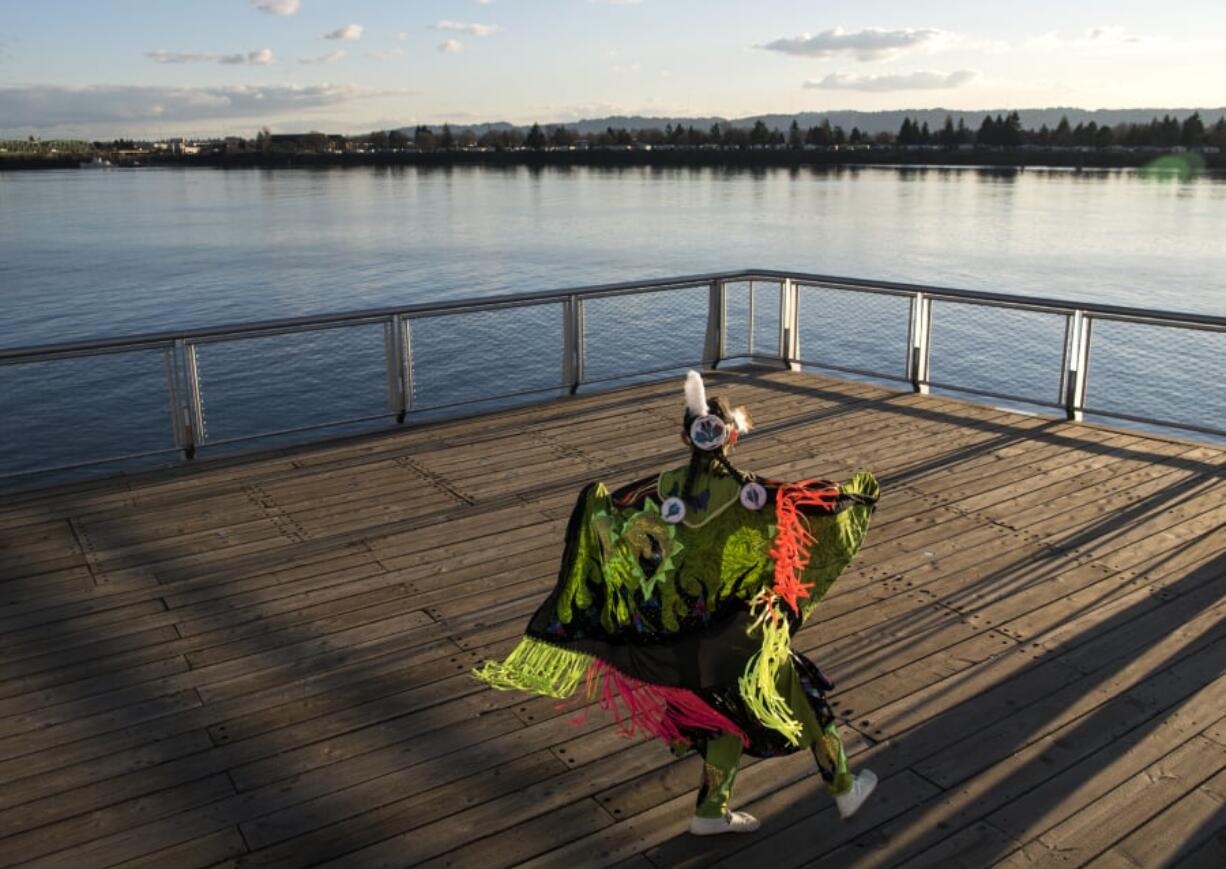 “When we dance, we’re praying.” Kat McAllister of Vancouver, 18, dons modern regalia made by her sister and mother, and dances a butterfly dance at Vancouver’s new Grant Street Pier. McAllister will be Lead Lady Dancer at Saturday’s annual Traditional Pow Wow at Heritage High School.