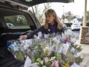 Kelley Bishop volunteers to drop off flowers from Portland-based The Bloom Project every Wednesday at the Ray Hickey Hospice House in Vancouver. Bishop drives about 30 minutes to Portland to pick up the flowers, then drives back to Vancouver to drop them off.