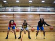 Hudson’s Bay sophomore Jaydia Martin, left, Hudson’s Bay freshman Aniyah Hampton, center, and sophomore Kamelai Powell, right, are pictured at practice on Feb. 21, 2019.