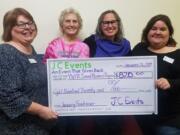 Orchards: Carol Taylor of JC Events, from left, Cheryl Eggert of Pied Piper Pizza, Laurie Schacht of Clark County YWCA and Jennifer Melton of JC Events at JC Events’ Bunco Night fundraiser, which brought in $820 for the YWCA’s Sexual Assault Program.