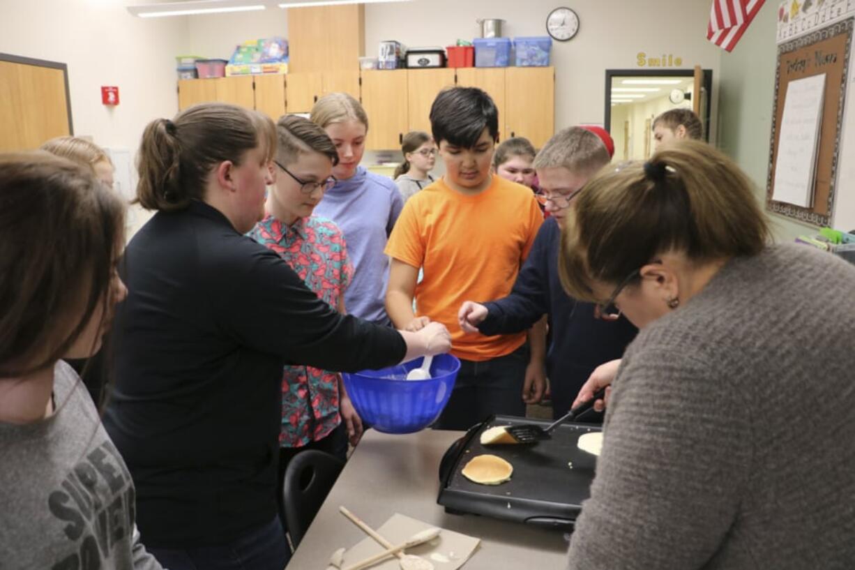 Battle Ground: Daybreak Middle School students in the new peer mentoring program worked together recently to make pancakes.