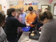 Battle Ground: Daybreak Middle School students in the new peer mentoring program worked together recently to make pancakes.