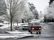 Melted snow covers the road along NW 99th Street in Vancouver on Monday morning, Feb. 25, 2019.