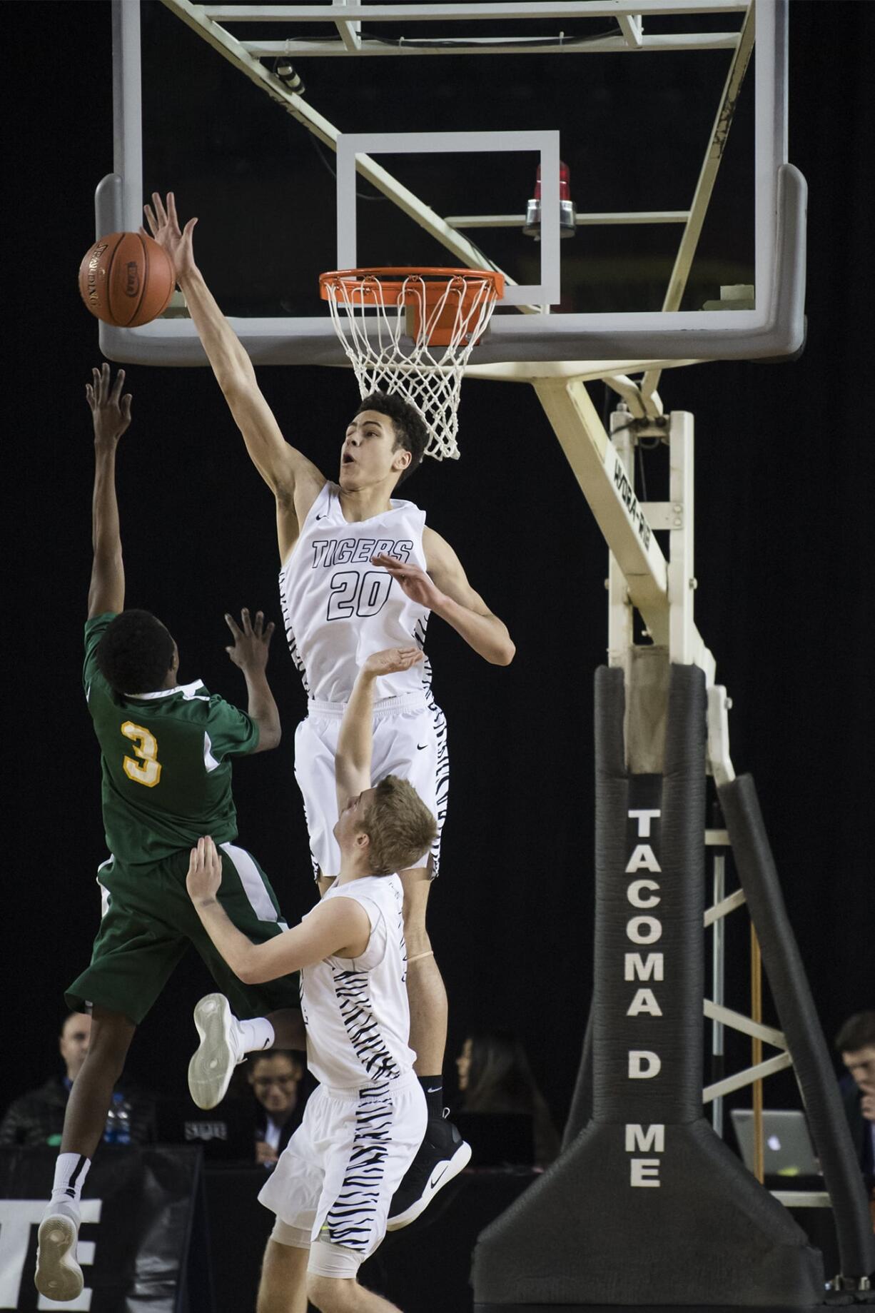 Battle Ground's Kaden Perry blocks a shot from Kentridge's Moses Moore during the 4A Hardwood Classic at the Tacoma Dome on Wednesday, Feb. 27, 2019.