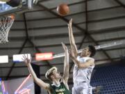 Battle Ground's Kaden Perry shoots past a Kentridge defender during the 4A Hardwood Classic at the Tacoma Dome on Wednesday, Feb. 27, 2019.