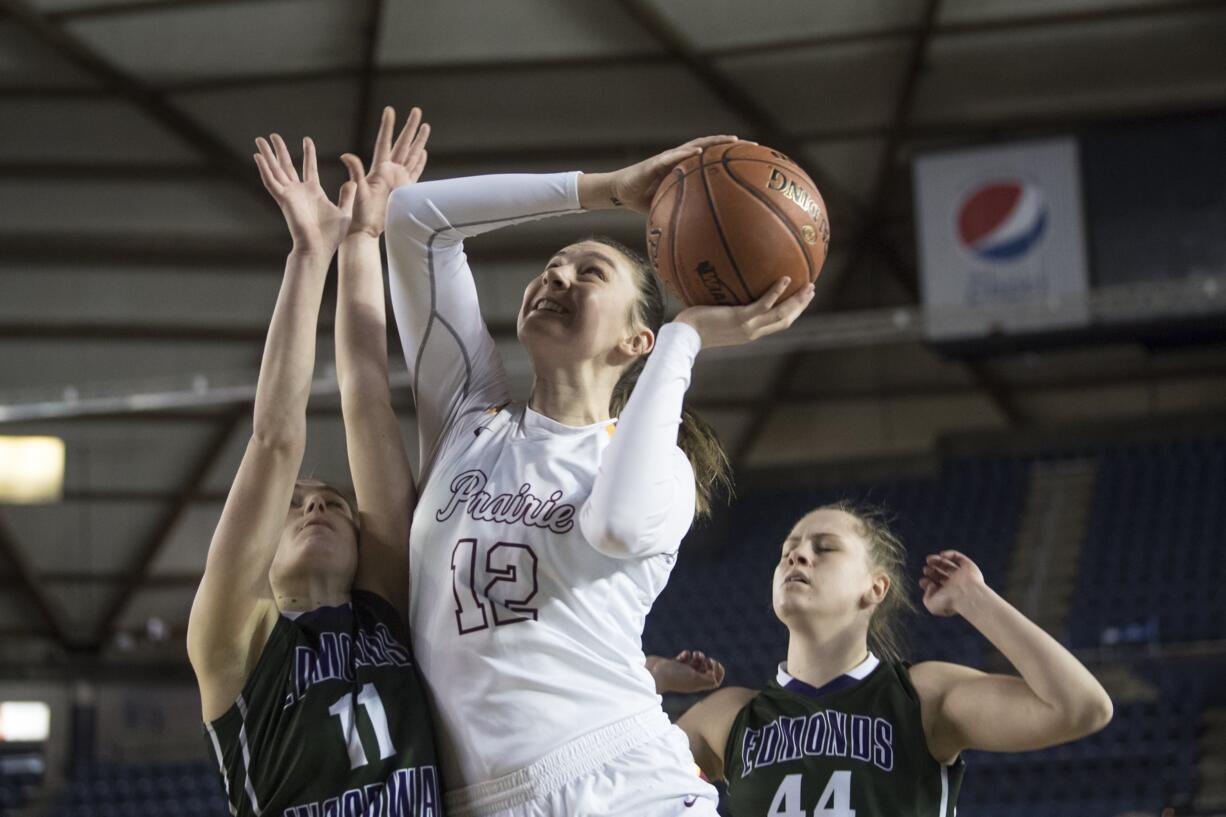 Prairie's Brooke Walling shoots the ball while under pressure from Edmonds-Woodway defenders during the 3A Hardwood Classic at the Tacoma Dome on Thursday, Feb. 28, 2019.