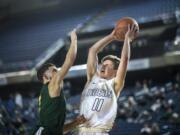 Battle Ground's Nathan Millspaugh is blocked by a Kentridge defender during the 4A Hardwood Classic at the Tacoma Dome on Wednesday, Feb. 27, 2019.