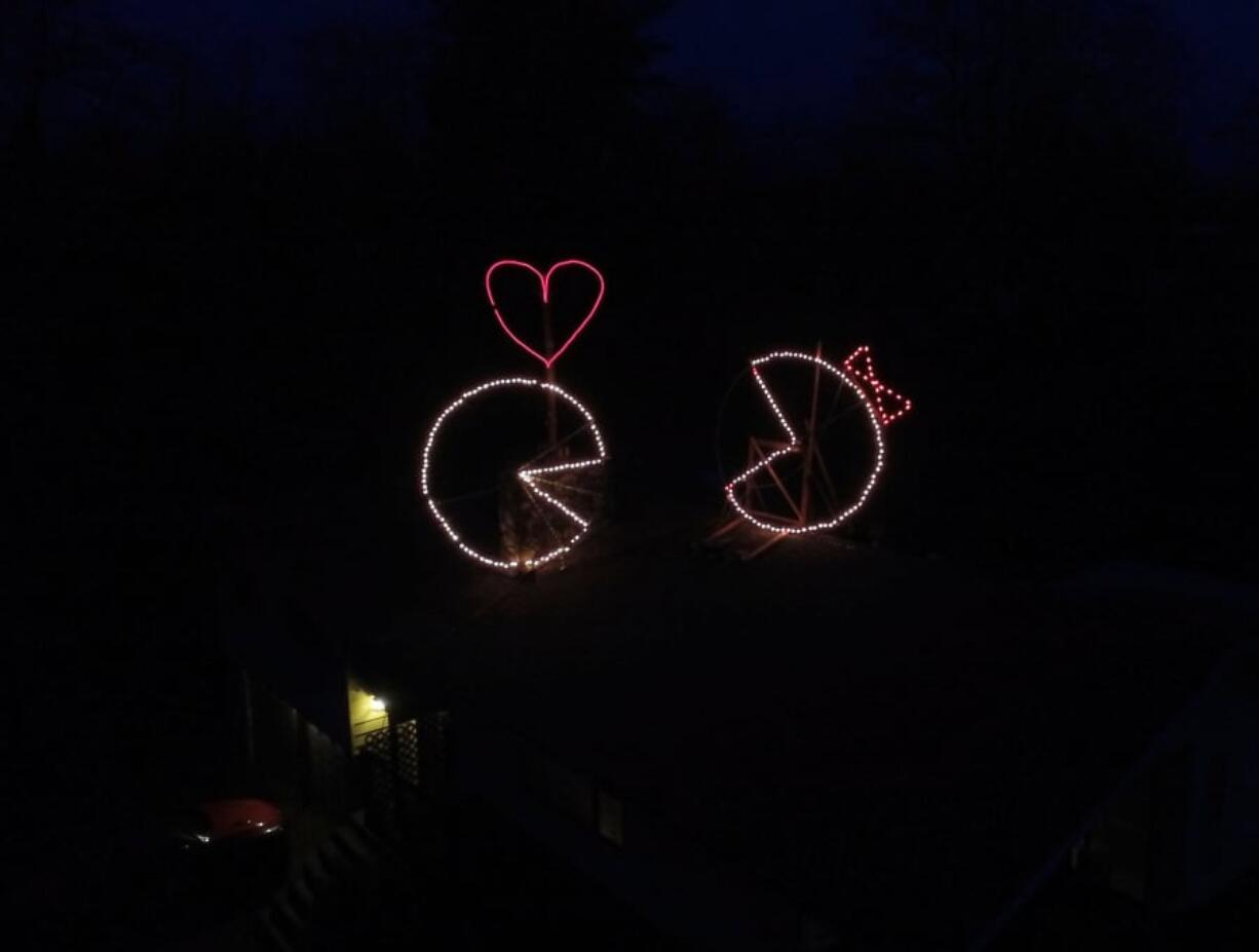 Battle Ground: To celebrate Valentine’s Day and his wedding anniversary, Oca Hoeflein built a Ms. Pac-Man statue on his roof to join his Pac-Man statue, which he put up at Christmastime.