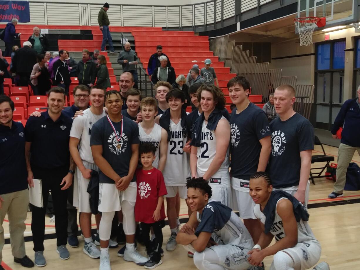 The King's Way Christian boys team poses for a photo after beating Overlake to advance to the 2A state tournament round-of-12 in Yakima (Tim Martinez/The Columbian)