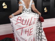 Joy Villa arrives at the 61st annual Grammy Awards wearing a dress that reads “Build the Wall” on Sunday at the Staples Center in Los Angeles.