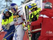 United States' Lindsey Vonn is assisted after crashing during the women's super G at the alpine ski World Championships, in Are, Sweden, Tuesday, Feb. 5, 2019.