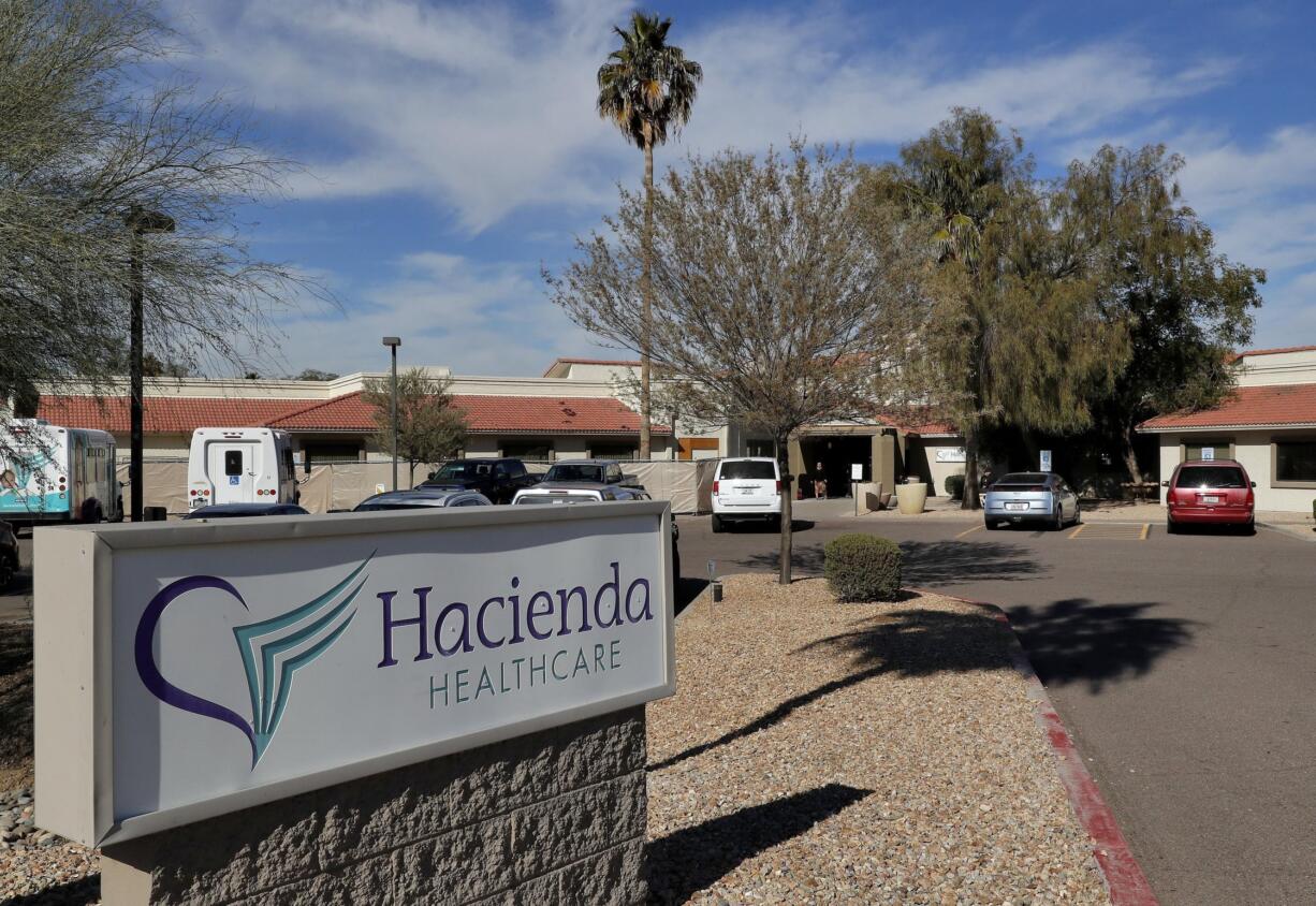 FILE - This Jan. 25, 2019, file photo shows the Hacienda HealthCare facility in Phoenix. The rape of an incapacitated woman at this facility is driving Arizona to catch up to 10 states with laws or regulations governing electronic monitoring and other technology aimed at deterring abuse inside long-term care facilities. Renewed attention on safeguarding vulnerable residents at care centers comes after an incapacitated woman gave birth at a Phoenix facility in Dec. 2018.