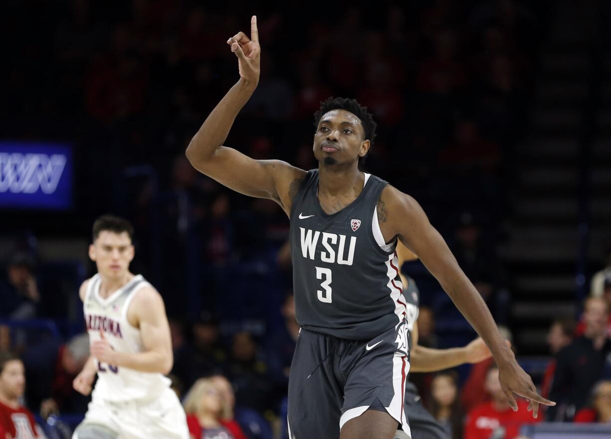 Washington State forward Robert Franks gestures after scoring a basket against Arizona during the second half of an NCAA college basketball game Saturday, Feb. 9, 2019, in Tucson, Ariz. Washington State won 69-55.