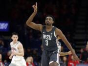 Washington State forward Robert Franks gestures after scoring a basket against Arizona during the second half of an NCAA college basketball game Saturday, Feb. 9, 2019, in Tucson, Ariz. Washington State won 69-55.