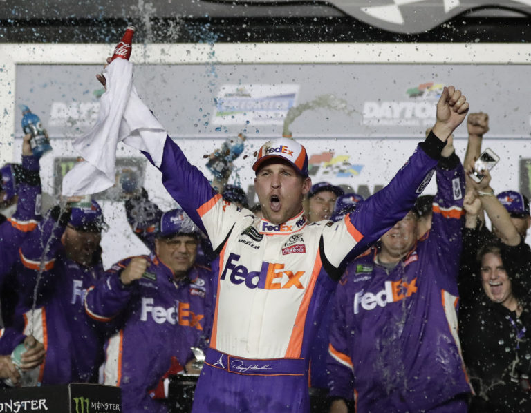 Denny Hamlin celebrates in Victory Lane after winning the NASCAR Daytona 500 auto race at Daytona International Speedway, Sunday, Feb. 17, 2019, in Daytona Beach, Fla.