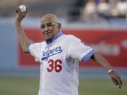 Former Los Angeles Dodgers pitcher Don Newcombe throws a ceremonial pitch before a game between the Los Angeles Dodgers and the Cleveland Indians in 2014. Newcombe died Tuesday, Feb. 19, 2019, after a lengthy illness. He was 92.