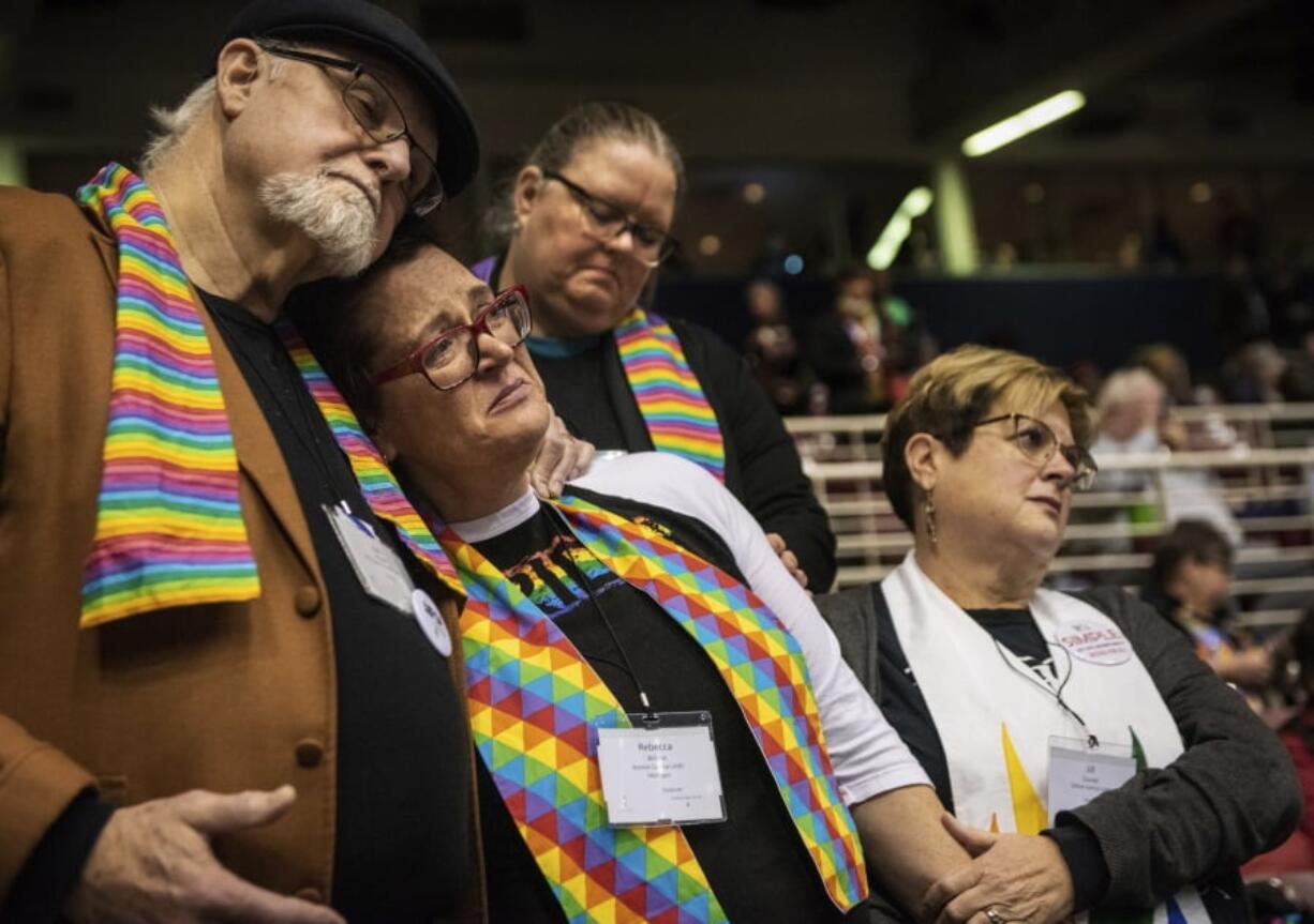 Ed Rowe, from left, Rebecca Wilson, Robin Hager and Jill Zundel react to the defeat of a proposal that would allow LGBT clergy and same-sex marriage within the United Methodist Church Tuesday at the denomination’s 2019 Special Session of the General Conference in St. Louis.