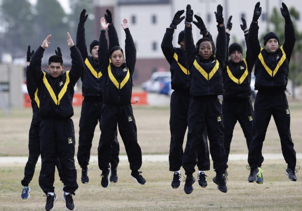 In this Jan. 8, 2019, photo, U.S. Army troops in training to become instructors, participate in the new Army combat fitness test at the 108th Air Defense Artillery Brigade compound at Fort Bragg, N.C. The new test is designed to be a more accurate test of combat readiness than the present requirements.