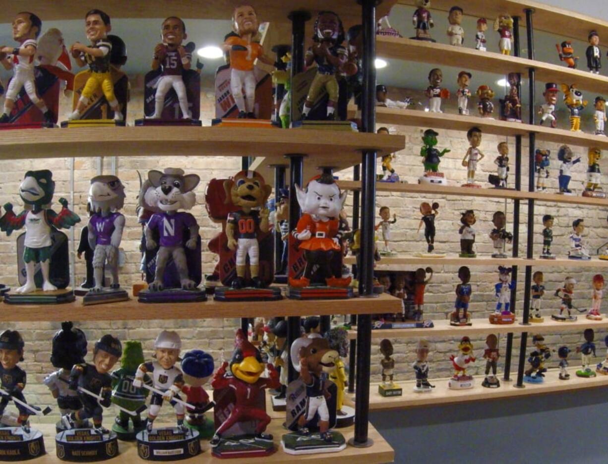 In this Jan. 8, 2019 photo bobbleheads are on display at the National Bobblehead Hall of Fame and Museum in Milwaukee. The new museum may well hold the largest collection of bobbleheads anyone has ever seen, displaying more than 6,500 figures of athletes, mascots, celebrities, animals, cartoon characters, politicians and more.