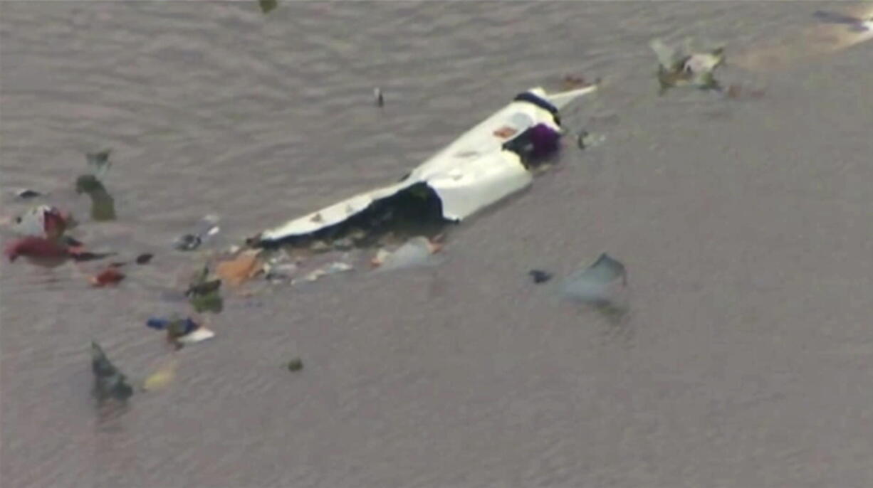 This image taken from video provided by KRIV FOX 26 shows the scene of a cargo plane crash on Saturday, Feb. 23, 2019 in Trinity Bay, just north of Galveston Bay and the Gulf of Mexico in Texas. Lynn Lunsford with the Federal Aviation Administration did not immediately know the status of the people aboard and the Chambers County Sheriff’s Office could not immediately be reached for comment.