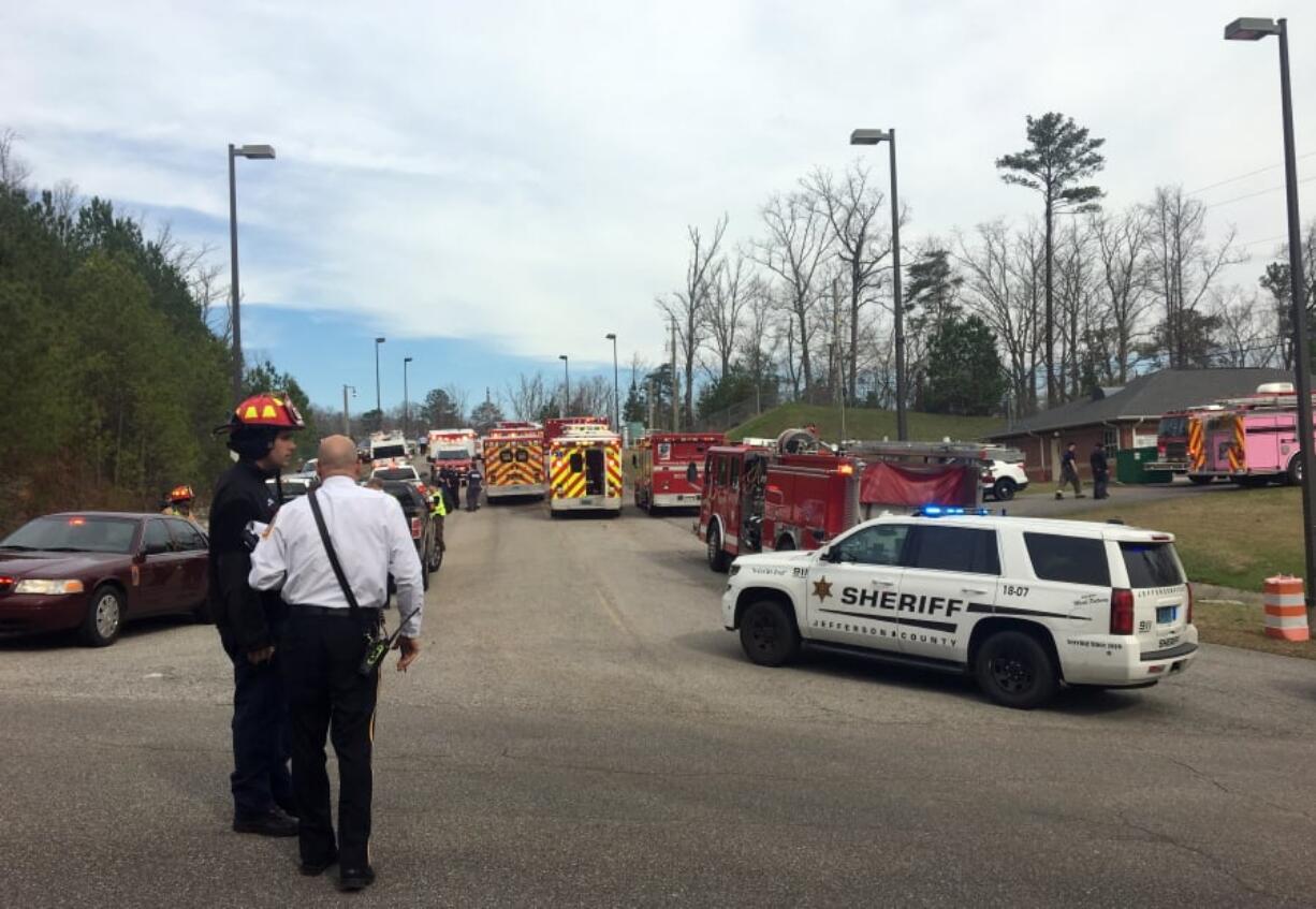 Emergency personnel gather near Birmingham Water Works where a chemical spill sent more than 50 people to the hospital, Wednesday, Feb. 27, 2019.