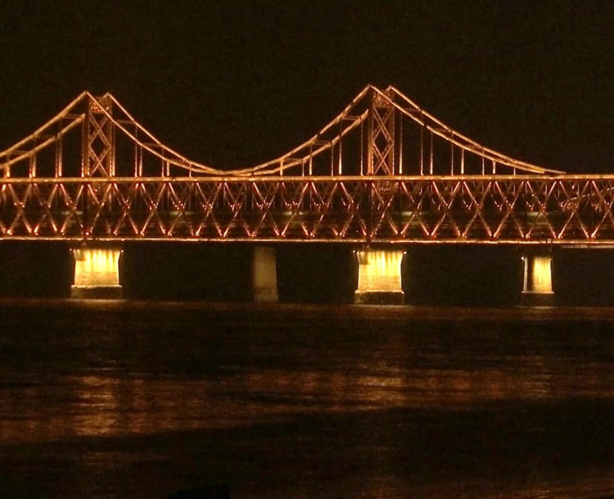 In this image taken from video footage, a train similar to ones seen during previous visits to China by North Korean leader Kim Jong Un crosses the Friendship Bridge from North Korea into China as seen from Dandong in northeastern China’s Liaoning Province, Saturday, Feb. 23, 2019. A train similar to one used in the past by Kim Jong Un entered China on Saturday evening, possibly carrying the North Korean leader on a journey to Vietnam’s capital for his summit with President Donald Trump.