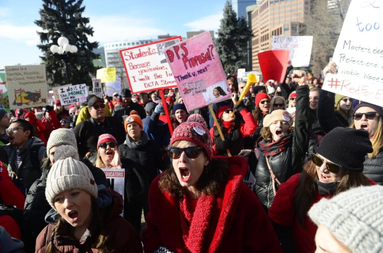 Lori Gates, center, a 3rd grade teacher from Park Hill elementary school, shouts with other teachers during a strike rally on the west steps of the state Capitol on the first day of the Denver Public Schools Teacher’s strike, Monday, Feb. 11, 2019, in Denver. More negotiations are set for Tuesday. (Helen H.