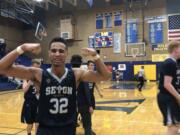 Seton Catholic's Xavian Rushing flexes in the moments after winning a 1A state tournament berth in a rout of Montesano on Saturday.