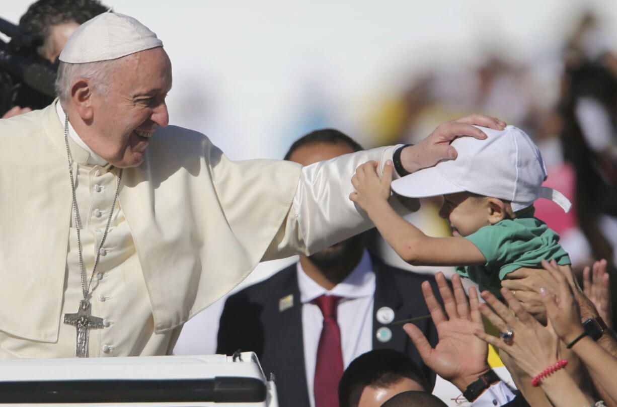 Pope Francis blesses a boy during a Mass at the Sheikh Zayed Sports City in Abu Dhabi, United Arab Emirates, Tuesday, Feb. 5, 2019. Francis travelled to Abu Dhabi to participate in a conference on inter religious dialogue sponsored the Emirates-based Muslim Council of Elders, an initiative that seeks to counter religious fanaticism by promoting a moderate brand of Islam.