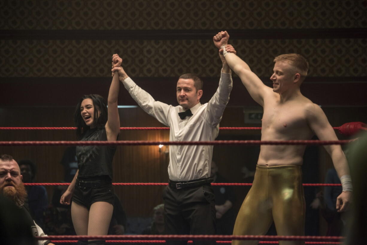 This image released by Metro Goldwyn Mayer Pictures shows Florence Pugh, left, and Jack Lowden, right, in a scene from “Fighting with My Family.” (Robert Viglasky/Metro Goldwyn Mayer Pictures via AP)