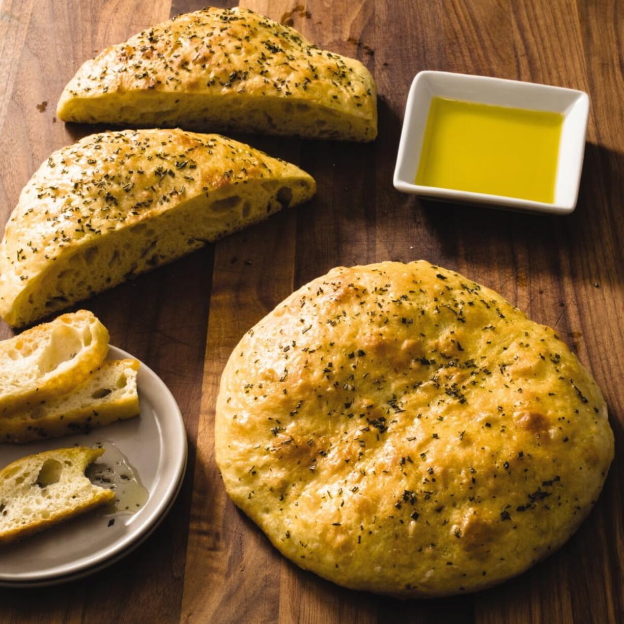 Rosemary Focaccia appears in the cookbook “Tasting Italy.” (Carl Tremblay/America’s Test Kitchen)