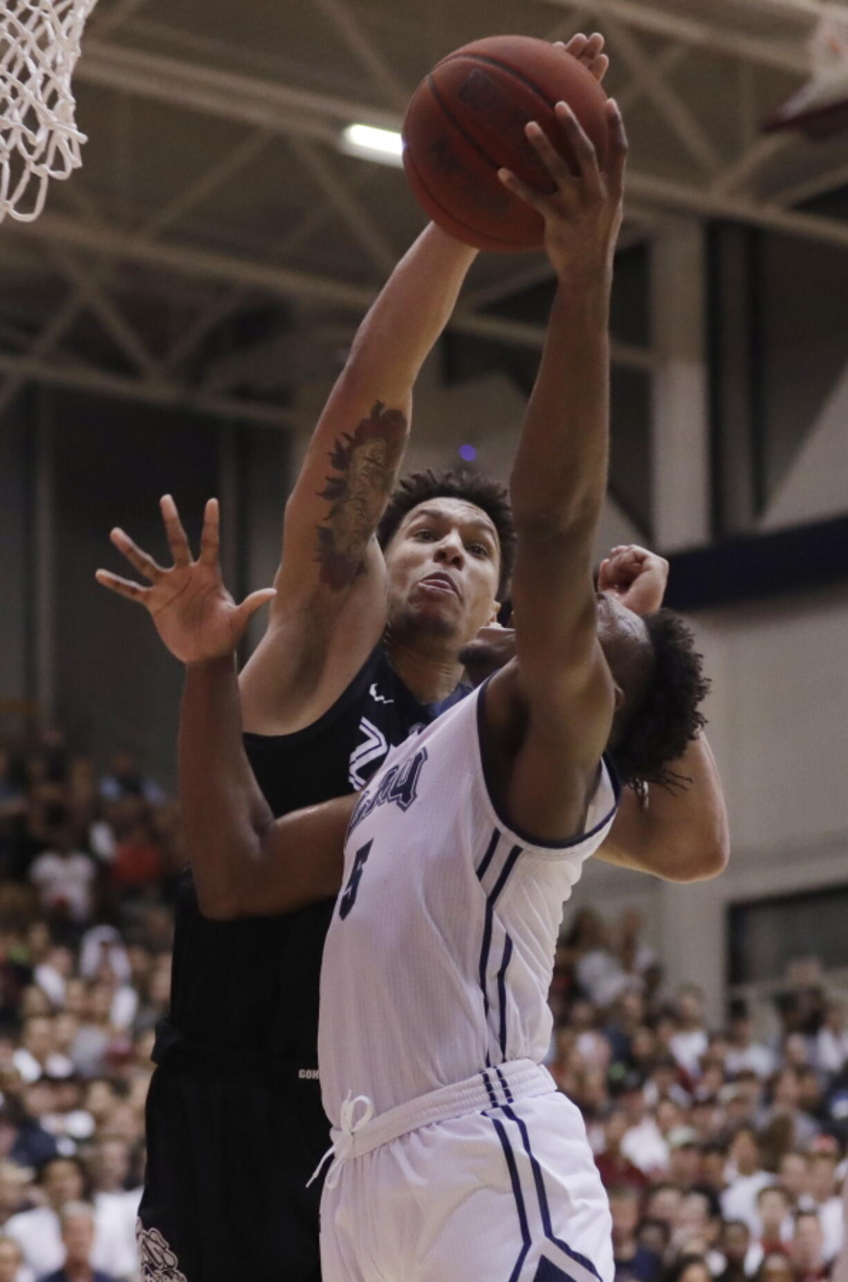 Gonzaga forward Brandon Clarke, left, blocks a shot from Loyola Marymount guard James Batemon during the second half of an NCAA basketball game Thursday, Feb. 14, 2019, in Los Angeles.