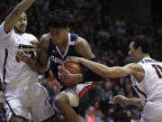 Gonzaga’s Rui Hachimura, center, drives the ball between Pacific’s Jeremiah Bailey, left, and Khy Kabellis during the first half of an NCAA college basketball game Thursday, Feb. 28, 2019, in Stockton, Calif.