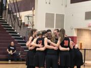 The Washougal girls basketball team huddles before its 2A state tournament game against East Valley of Spokane on Saturday at University High in Spokane Valley.