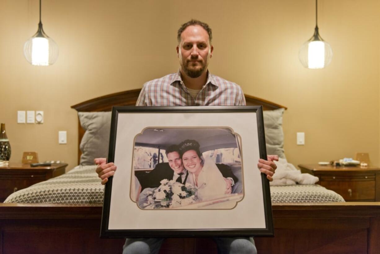 Andy Miller with a photo of his wedding day about 20 years ago when he married Jaime Miller. Jaime Miller, who was known as the life of every party, had a piece of legislation crafted in her honor and an endowment fund named after her announced this week.