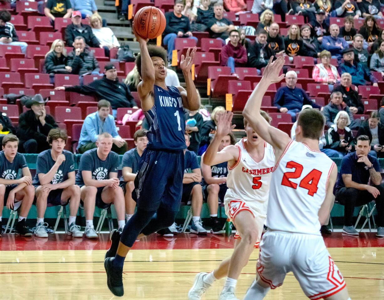 King's Way's Khalfani Cason (1), comes in off the three point line to score two points over Cashmere's Carter Alberts (24), during the first round of the WIAA 1A boys state tournament on Wednesday, Feb. 27, 2019, at the Yakima Valley SunDome. King's Way Christian defeated Cashmere 67-52.