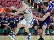 La Center's Avery Seter (12), grabs an errant pass before taking a shot against Connell's Austin Smith (13), during the WIAA 1A boys state tournament on Thursday, Feb. 28, 2019, at the Yakima Valley SunDome. The La Center Wildcats defeated the Connell Eagles 68-45.