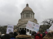 Opponents of efforts to remove philosophical exemptions from school-vaccine requirements rally outside the Washington Capitol on Wednesday in Olympia.