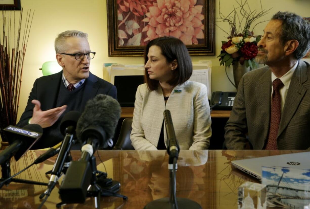 Department of Health Secretary John Wiesman, left, talks speaks during a press event in Olympia with Dr. Robyn Rogers, center, and Dr. Gary Goldbaum. Rogers, who represents the American Academy of Pediatrics, and Goldbaum of the Washington State Medical Association, spoke in favor of a bill that would remove the state’s personal exemption for vaccination requirements.