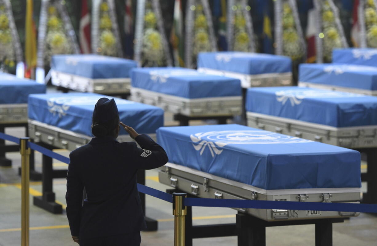 FILE - In this Aug. 1, 2018, file photo, a U.S. soldier salutes during a repatriation ceremony for the remains of U.S. soldiers killed in the Korean War and collected in North Korea, at the Osan Air Base in Pyeongtaek, South Korea. With their second summit fast approaching, speculation is growing that U.S. President Donald Trump may try to persuade North Korean leader Kim Jong Un to commit to denuclearization by giving him something he wants more than almost anything else, an announcement of peace and an end to the Korean War.