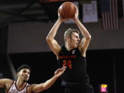 Oregon State forward Kylor Kelley (24) grabs a rebound next to Southern California forward Bennie Boatwright during the second half of an NCAA college basketball game Saturday, Feb. 23, 2019, in Los Angeles.