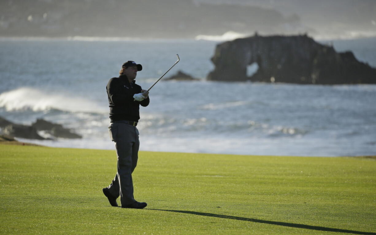 Phil Mickelson hits from the 18th fairway of the Pebble Beach Golf Links during the final round of the AT&T Pebble Beach Pro-Am golf tournament Monday, Feb. 11, 2019, in Pebble Beach, Calif. Mickelson won the tournament after finishing at 19-under-par.