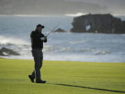 Phil Mickelson hits from the 18th fairway of the Pebble Beach Golf Links during the final round of the AT&T Pebble Beach Pro-Am golf tournament Monday, Feb. 11, 2019, in Pebble Beach, Calif. Mickelson won the tournament after finishing at 19-under-par.