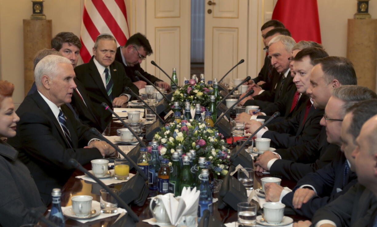 United States Vice President Mike Pence, 2nd left, speaks during a meeting with Poland’s President Andrzej Duda, 4th right, in Warsaw, Poland, Wednesday, Feb. 13, 2019. The Polish capital is host for a two-day international conference on the Middle East, co-organized by Poland and the United States.